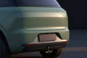 Black steel tow bar under the moss green rear bumper of the SUV