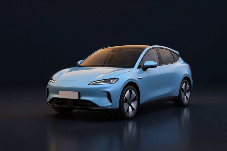 Ice blue compact electric hatchback with slim headlights, in a dark showroom