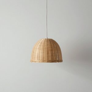 Dome-shaped pendant lamp of hand-woven natural rattan hanging from a white cable