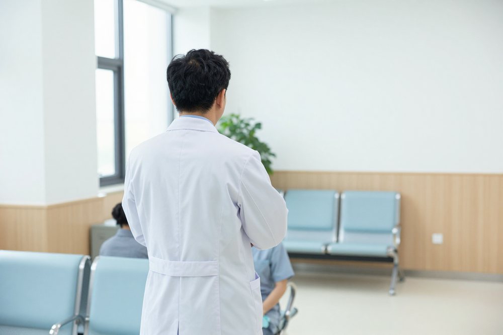 Doctor caring for a patient in a hospital room