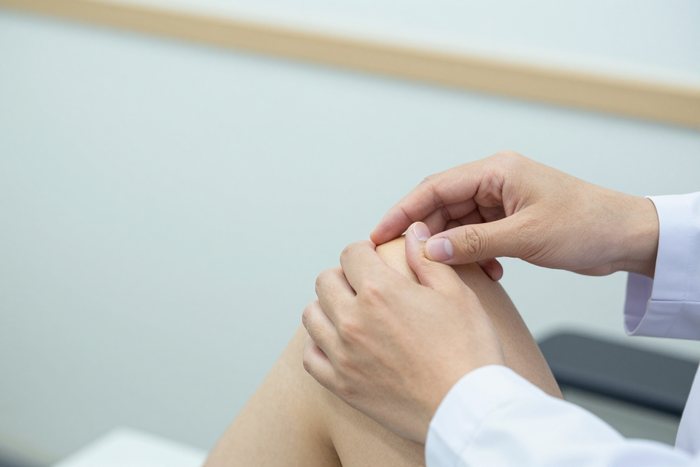 Clinician providing attentive patient care