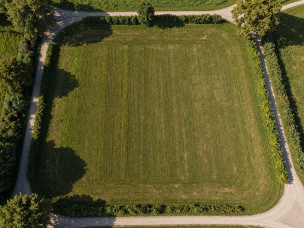 Aerial view of a mown plot bordered by hedges