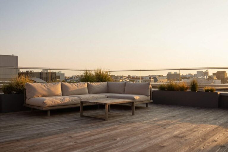 Rooftop terrace with an outdoor sofa at sunset